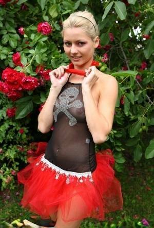 Cute blonde teen Buffy hikes up a tutu before masturbating in the back yard on fangals.org