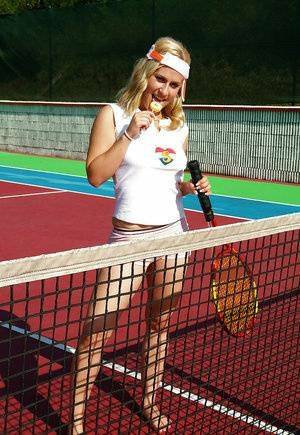 Sporty babe with big tits Angel B toying her cunt on the tennis court on fangals.org