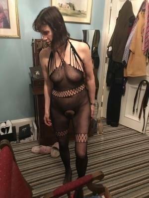 Older amateur Slut Scot Susan shows her beaver on a bed in a bodystocking on fangals.org