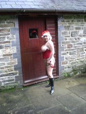 Blonde amateur Barby releases her big tits and butt from Xmas lingerie outside on fangals.org