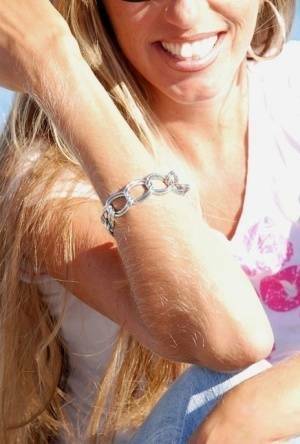 Amateur model Lori Anderson shows off her hairy arms while fully clothed on fangals.org