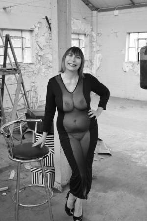 Middle-aged woman Barby Slut models a see-thru dress for a black-and-white gig on fangals.org