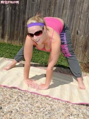 Blonde chick Dee Siren frees her huge ass from yoga pants outdoors on yoga mat on fangals.org