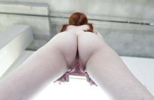 Young redhead Dolly Little revealing shaved pussy in pigtails and socks on fangals.org