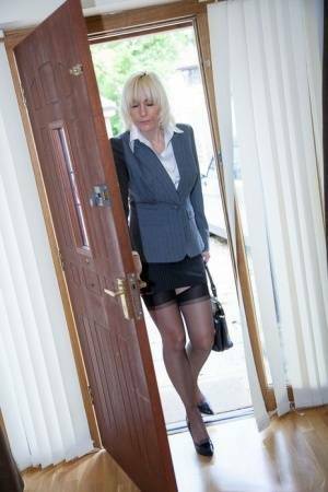 Older MILF Jan Burton strips off business clothes after a hard day at office on fangals.org