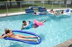 Frolic girls in bikini flashing their tits at the pool party on fangals.org