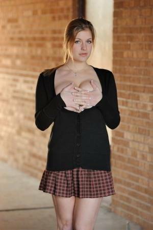 Amateur abbe letting big natural schoolgirl tits loose outdoors in socks on fangals.org