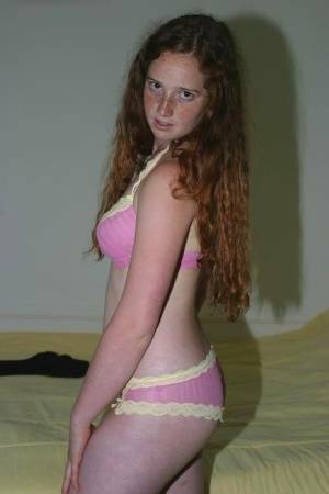 Flexible redhead Rachel showcases her natural pussy after lingerie removal on fangals.org