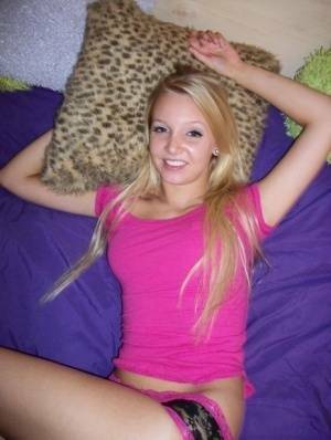 Cute teen girl with blonde hair shows off her tits and twat for the first time on fangals.org