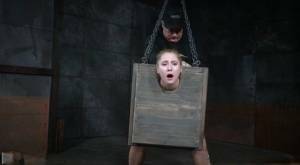 Blonde girl Odette Delacroix is made to suck a black cock with head in stocks on fangals.org