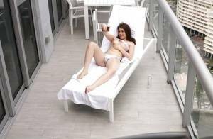 Brunette teen Kylie Quinn caught masturbating on balcony by voyeur on fangals.org