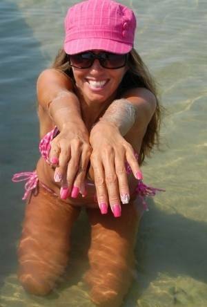 Amateur model Lori Anderson shows her hairy arms while wearing a bikini on fangals.org