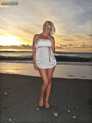 Hot blonde Anikka Albrite strips naked at the beach before nude hitchhiking on fangals.org