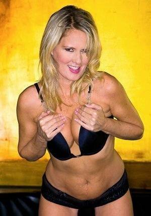 Blond MILF Bridgett Lee flaunting with her tits and big ass exposed on fangals.org