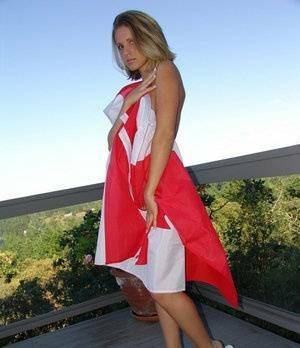 Canadian teen Karen wraps her naked body in a flag on her back deck on fangals.org