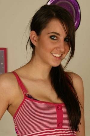 Young brunette Stacy H gets completely naked on a wooden table on fangals.org