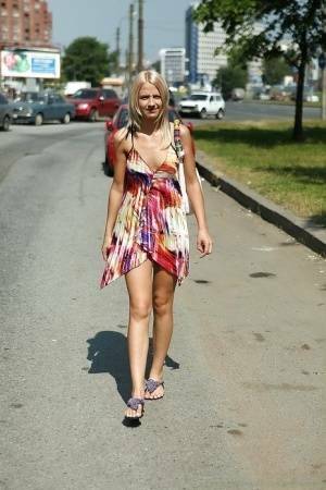 Charming teen blonde posing solo in a lovesome dress outdoor on fangals.org