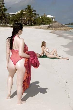 Fervent lesbians stripping nude and playing with dildos on the beach on fangals.org