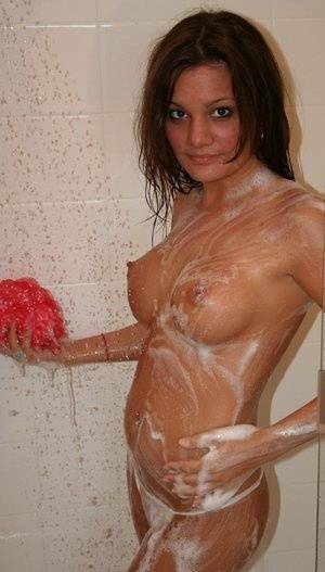 Teen amateur Kate Crush soaps her perky breasts while taking a shower on fangals.org