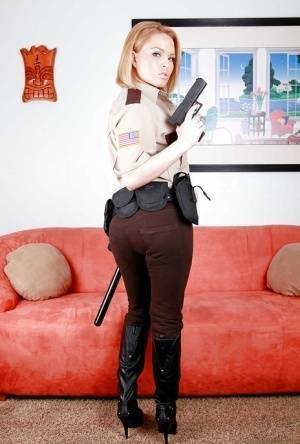 Hot babe in police uniform Krissy Lynn stripping and spreading her legs on fangals.org