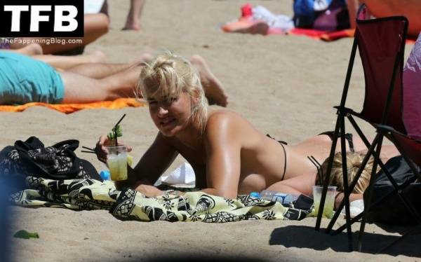 Sarah Connor Flashes Her Nude Breasts on the Beach on fangals.org