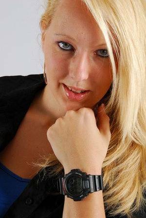 Blue-eyed blonde Britt displays her black G-Shock during non-nude action on fangals.org