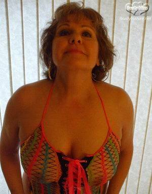 Mature woman Busty Bliss wears see thru attire during POV action on fangals.org