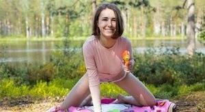 Young amateur Ava bares her hard body on a blanket near the water on fangals.org