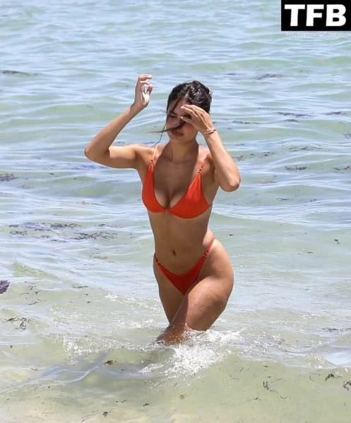 Tao Wickrath Stuns in Small Orange Bikini on the Beach in Miami on fangals.org