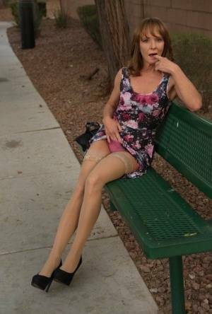 Aged lady flashes her tits and twat on a public bench before disrobing at home on fangals.org