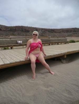 Older platinum blonde Barby exposes her plump body at the seaside on fangals.org