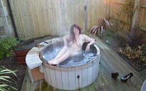 Amateur lady Barby Slut gets totally nude before getting in an outdoor hot tub on fangals.org