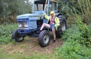 Mature amateur Barby Slut exposes herself on heavy equipment at a job site on fangals.org