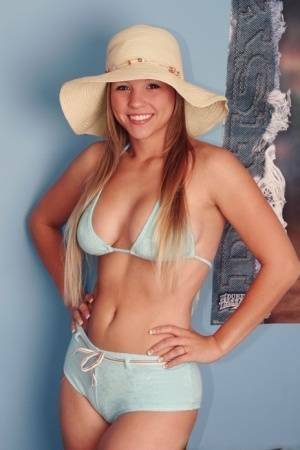 Solo girl Dawson Miller takes off her bikini while wearing a floppy sun hat on fangals.org